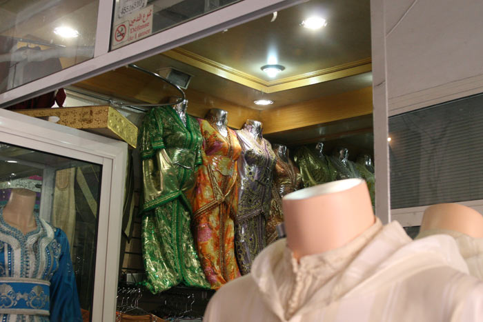 Photo clothes Marrakesh shop medina souk with traditional Moroccan clothes