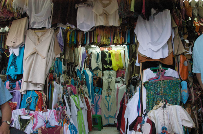Photo clothes Marrakesh shop medina souk with traditional Moroccan clothes