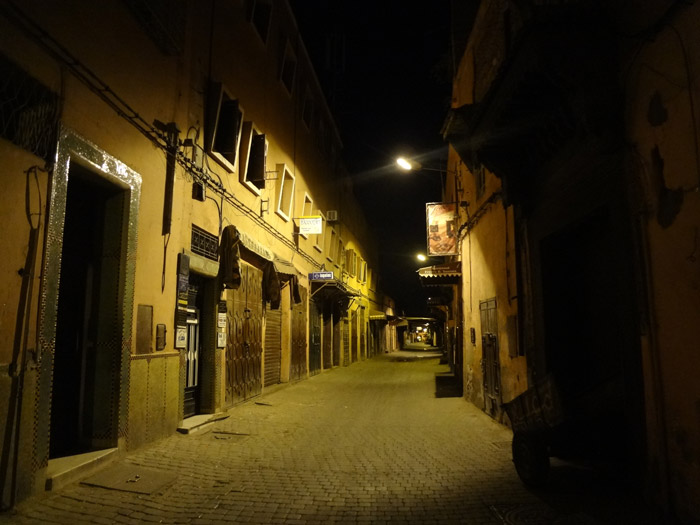 Photo of a Marrakech street in the old medina by night
