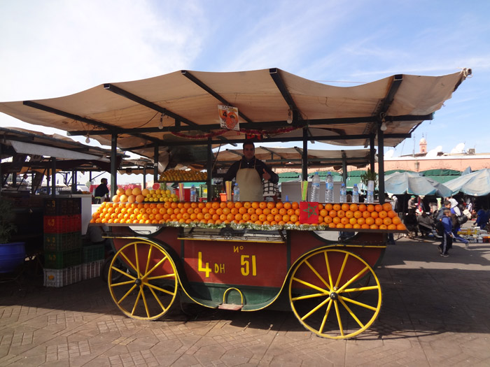 Photo of orange juice street vendor in Jemaa el Fna main square in Marrakech Morocco