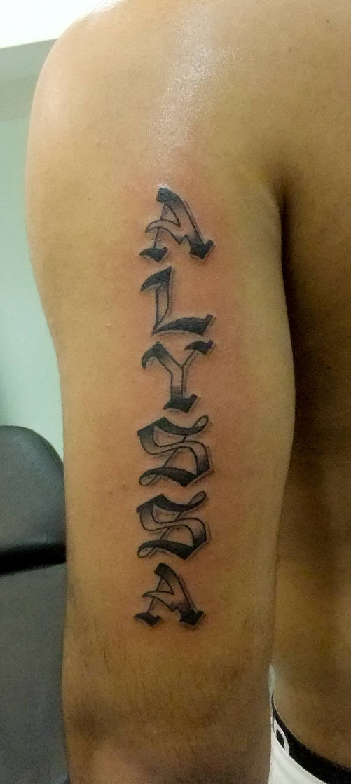 Vertical font tattoo idea on upper arm
