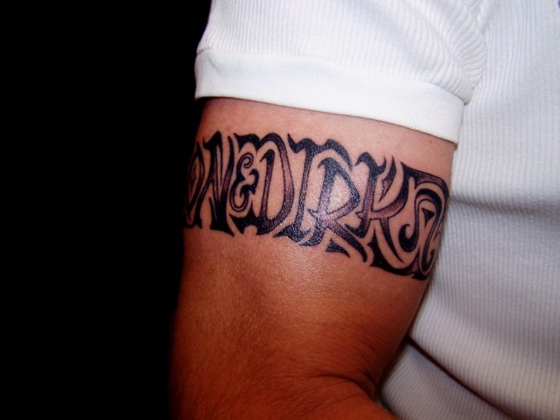 Armband design name tattoo for men’s bicep