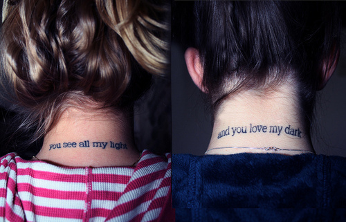 Friends matching tattoo design on neck