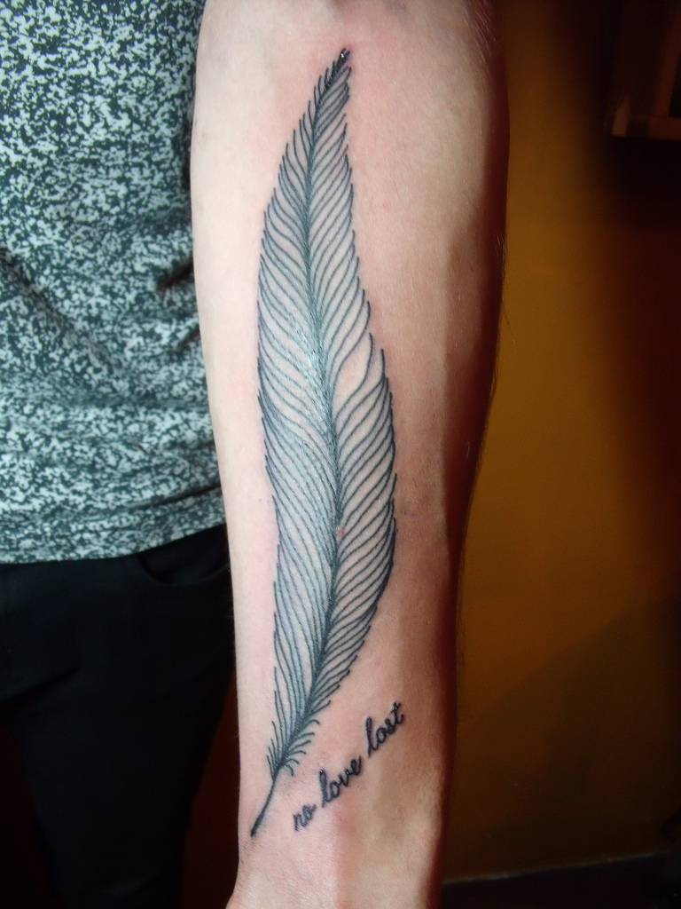 Feather tattoo designs on forearm