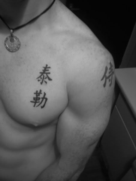 Kanji tattoo design idea on upper chest for man