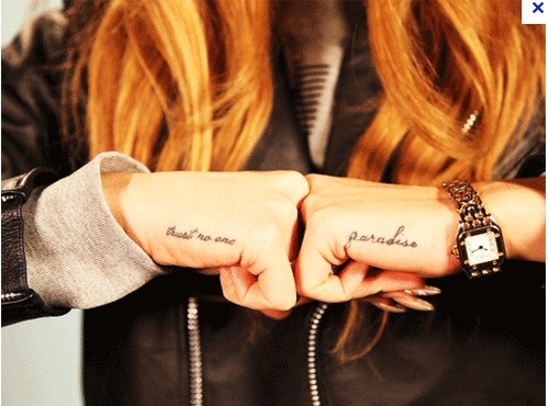 Cool name tattoos on both hands for woman