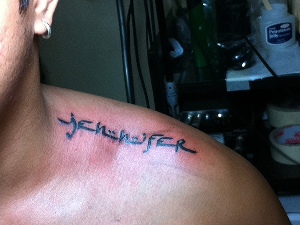 Jennifer name tattoo design on upper shoulder for man