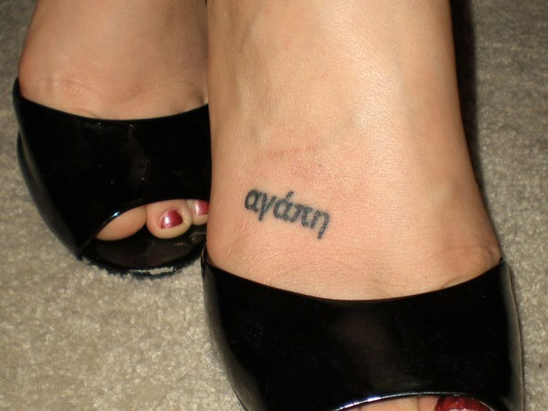 Feminine name tattoo design on foot