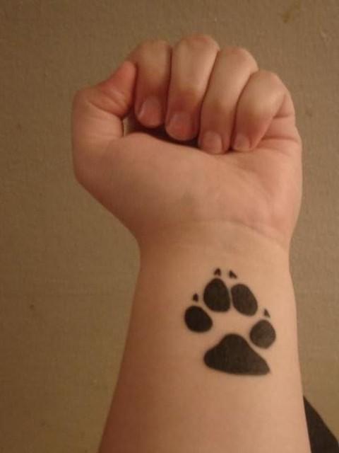 Bear paw wrist tattoo designs for men