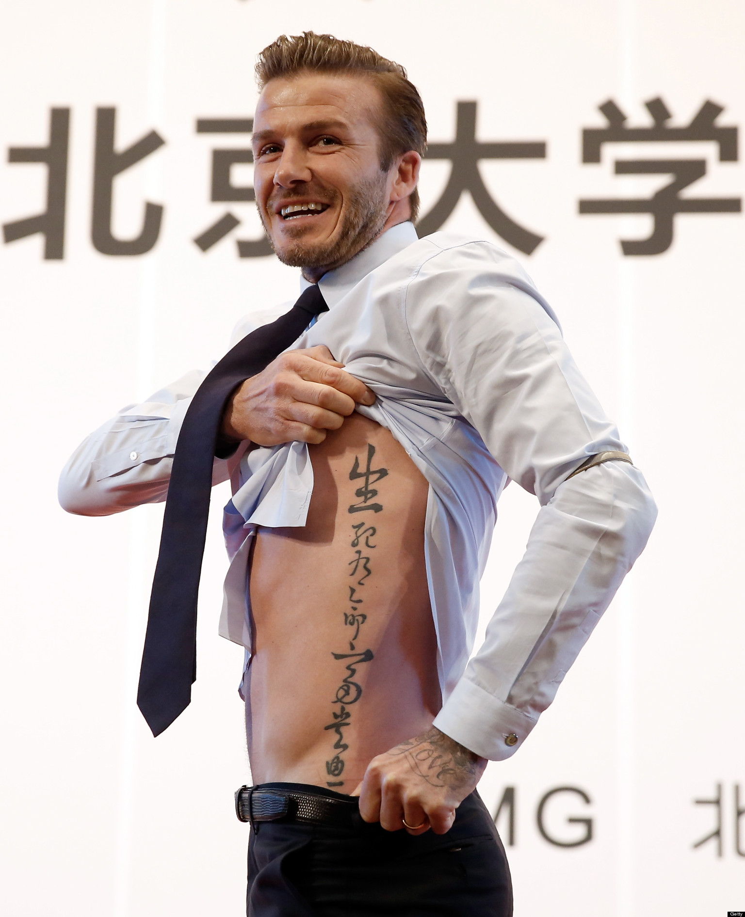 Hebrew name tattoo design, ribs side tattoo idea for man, here David Beckham