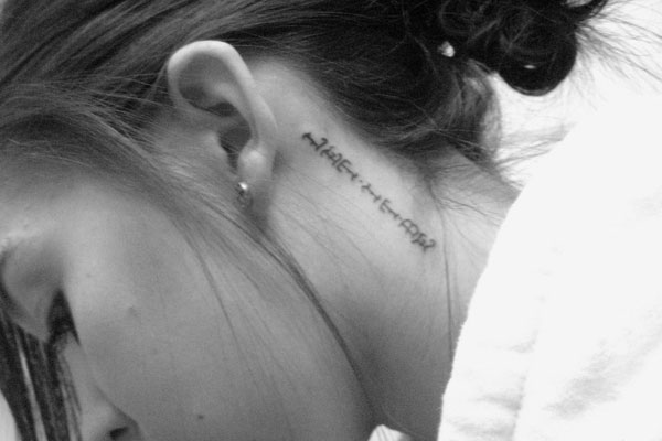 Vertical script back ear tattoo design