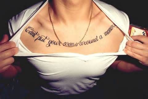 Quote tattoo idea on across collar bones for men