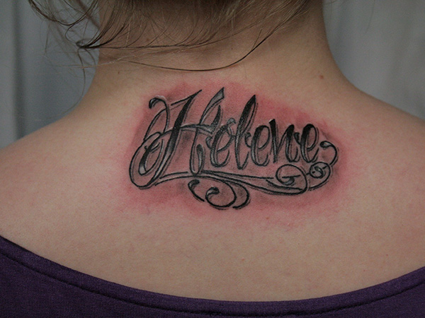 Chicano style name tattoo on neck for girls
