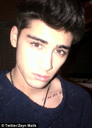 Arabic phrase tattoo idea on left collar bone