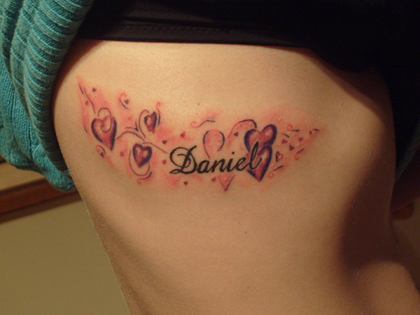 Baby name tattoo design with hearts - tattoo idea on ribs for female