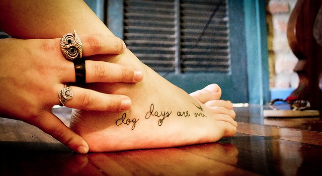 Handwriting style tattoo idea on foot