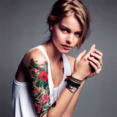 Flower motive sleeve tattoo for girls