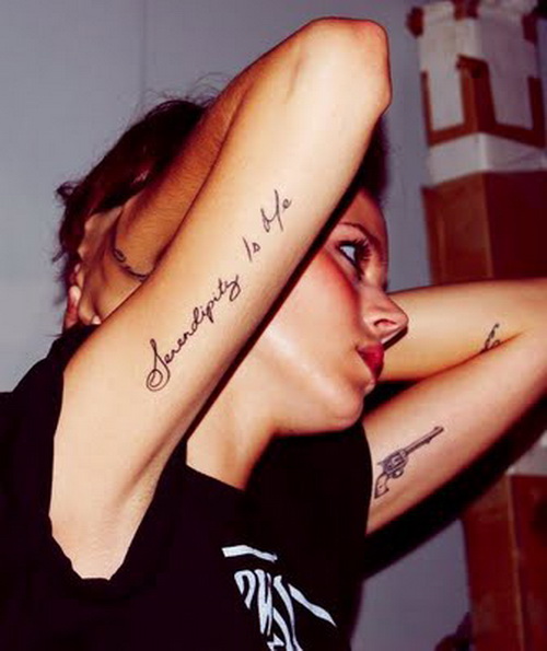 Upper arm script tattoo idea for women