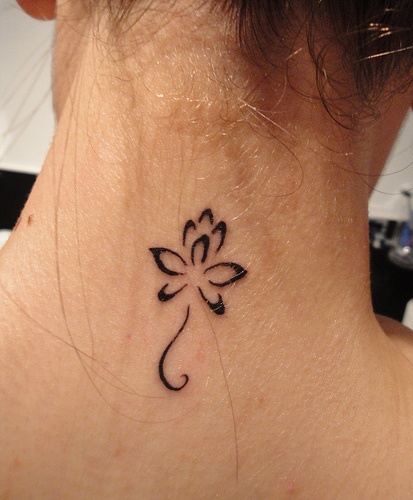 Little lotus flower tattoo design on neck