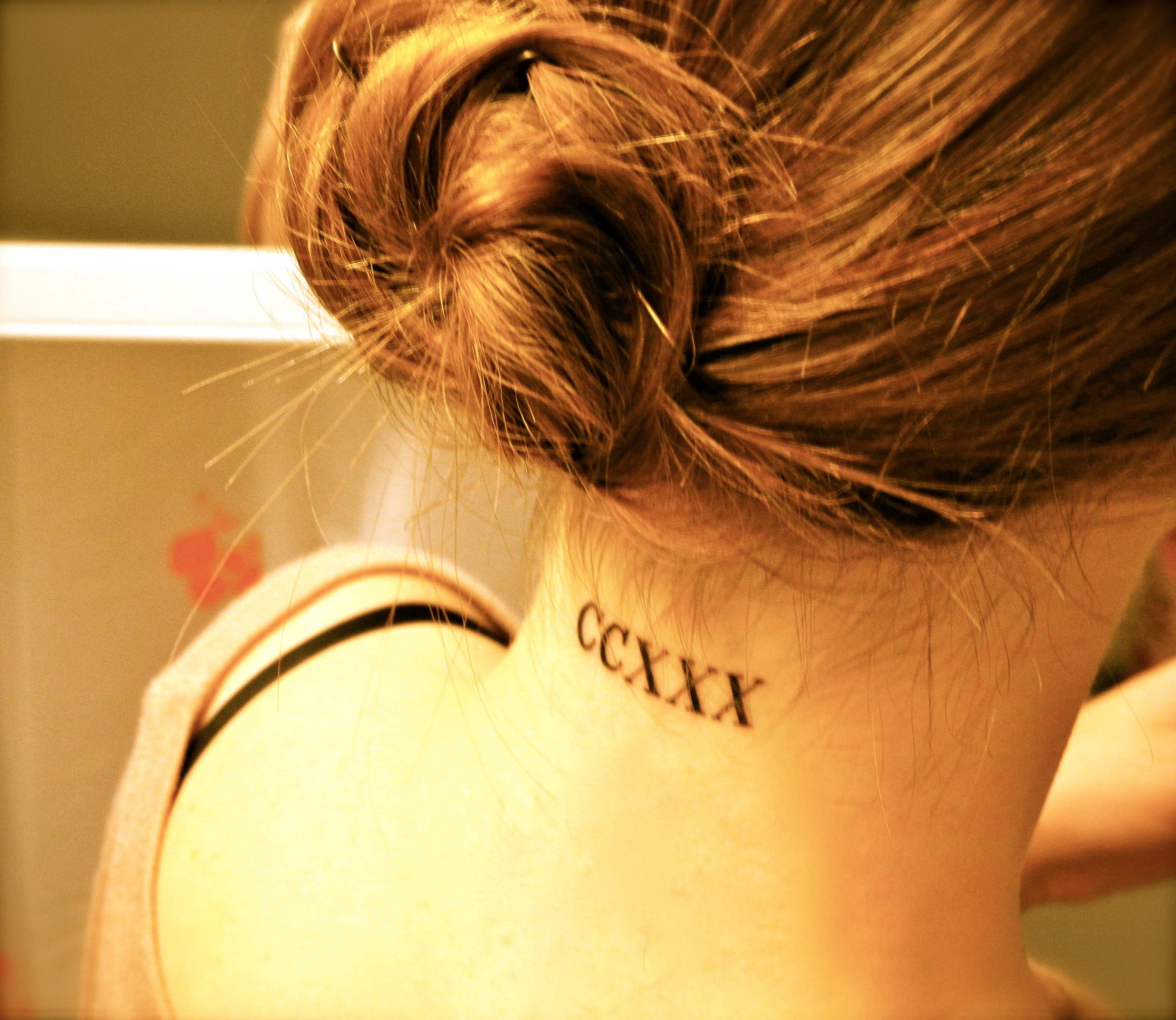 Roman numbers neck tattoo designs for female