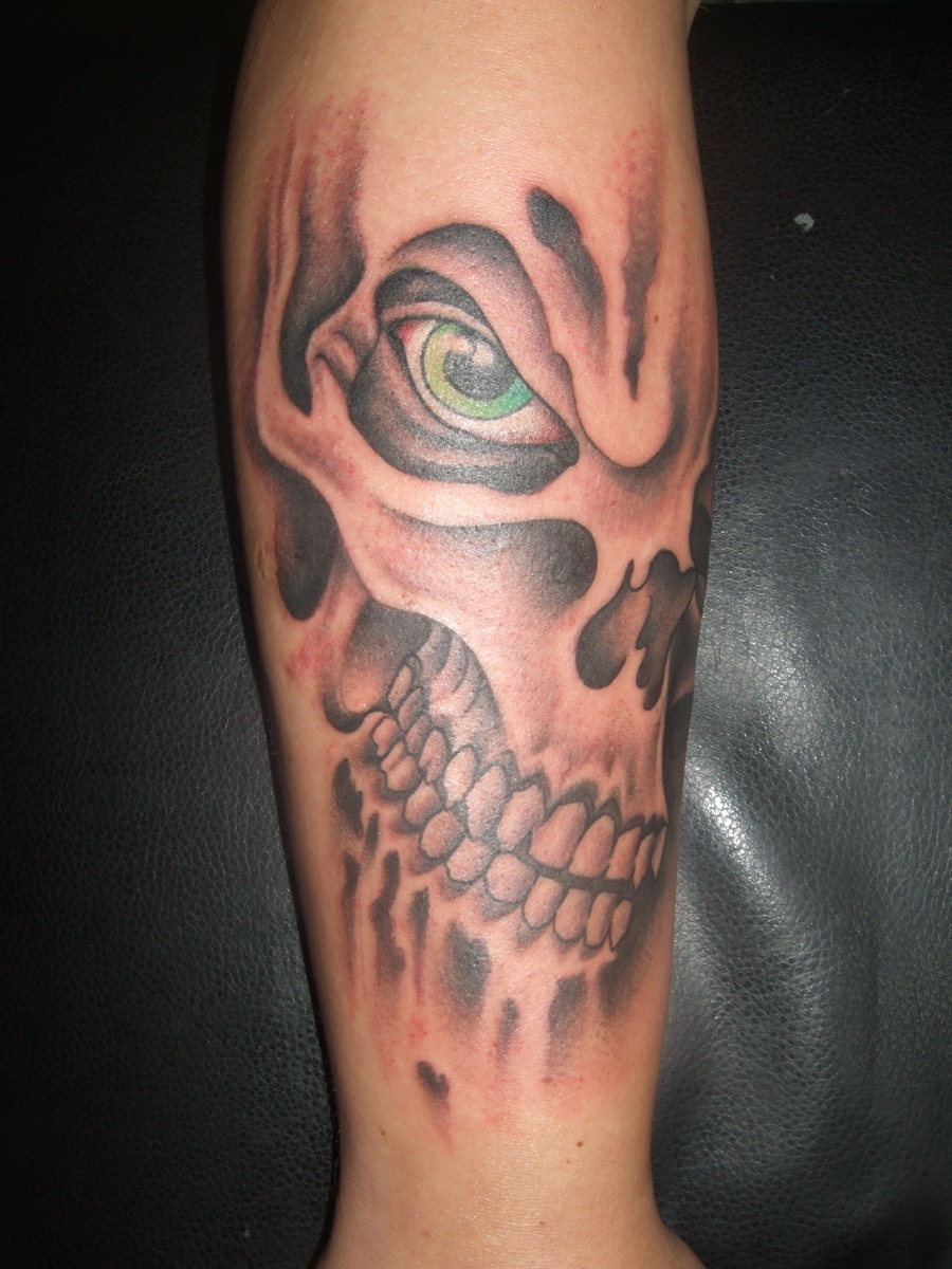 Skull with flames arm tattoo designs for men