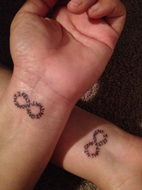 Infinity symbol and lettering tattoo design