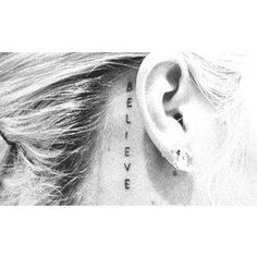Vertical script ear tattoo idea