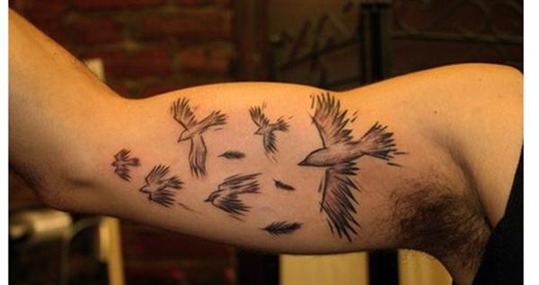 Flying birds inner arm bicep tattoo designs for men