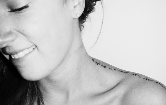 Feminine script tattoo idea on upper shoulder