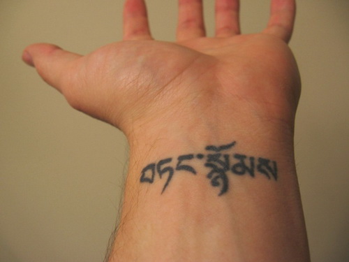 Hebrew script on wrist tattoo design for men