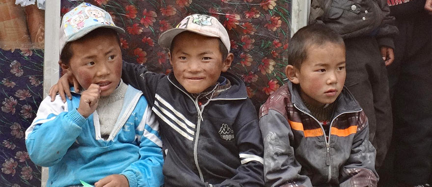 8 Days Tibet Tour • Kathmandu to Lhasa Overland Tibetan boys in Nyalam