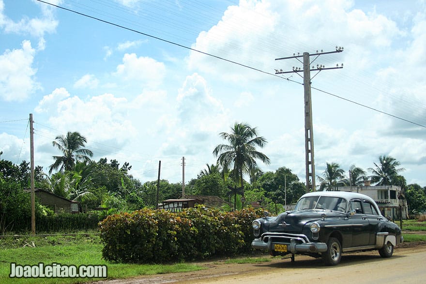 Black car by the side of the road in Cuba