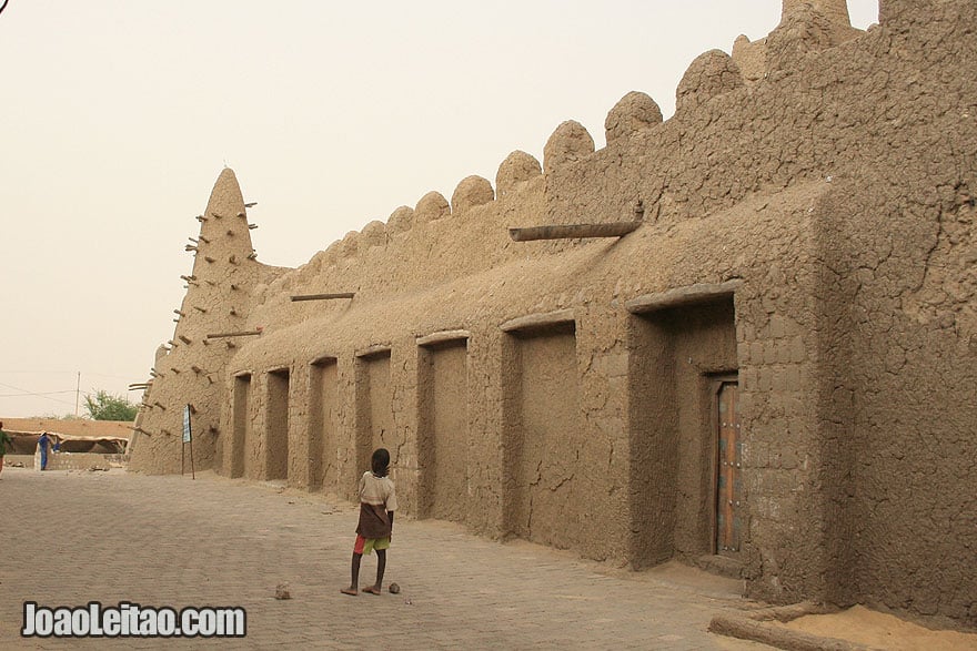 Visit Timbuktu Mali • The Mysterious City Deep Inside the Desert Boy playing football near sacred mosque