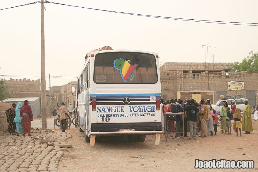 People waiting to go inside the bus