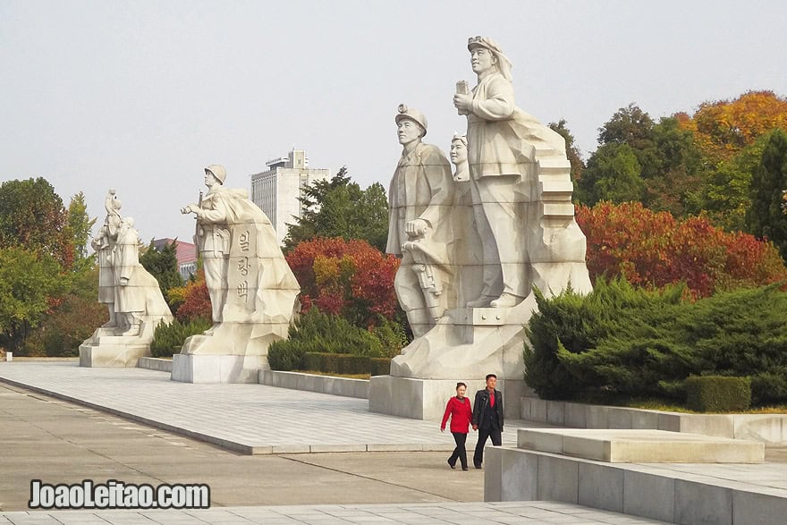 Couple walking in the Tower of Juche Idea complex in Pyongyang.