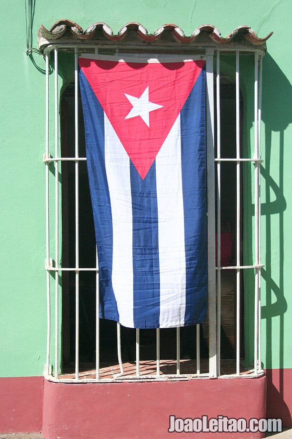 Cuban Flag on a window in Trinidad