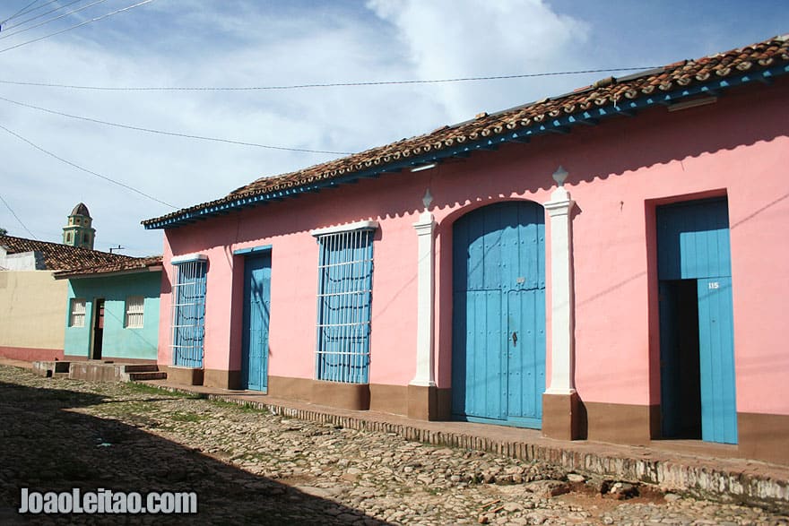 Pink building with blue doors and windows in Trinidad