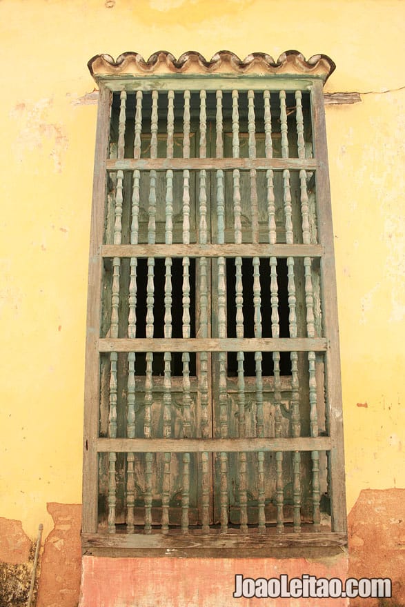 Wooden window and yellow building in Trinidad