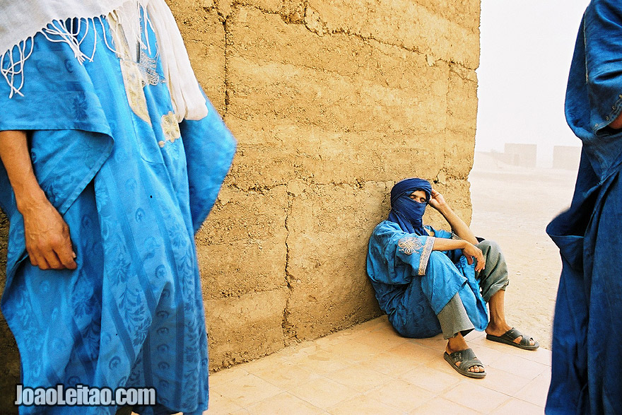 Photo of the Blue Men of Morocco during a sand storm in Sahara Desert, Morocco