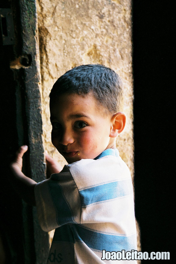 Photo of little boy waiting at the door, Morocco