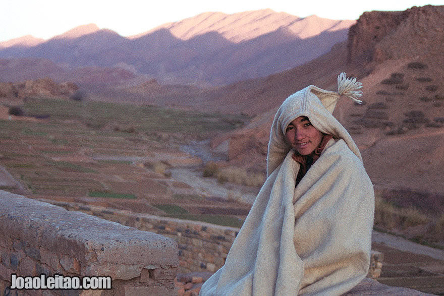 Photo of young boy wearing a traditional anzar in the Atlas Mountains, Morocco