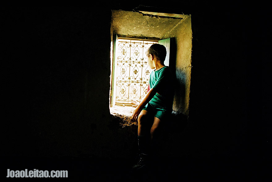 Photo of boy looking out the window, Morocco