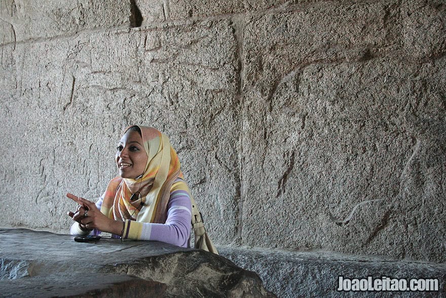 Egyptian woman guide explaining the Temple Complex of Karnak in Thebes