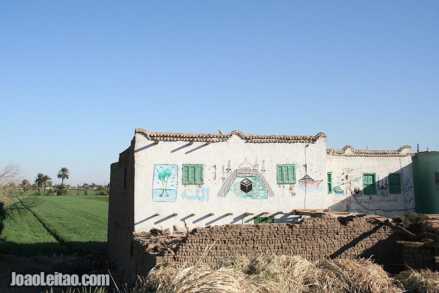 House with Islamic related paintings depicting Mecca in Saudi Arabia. We can also read the word ALLAH (God) written in Arabic