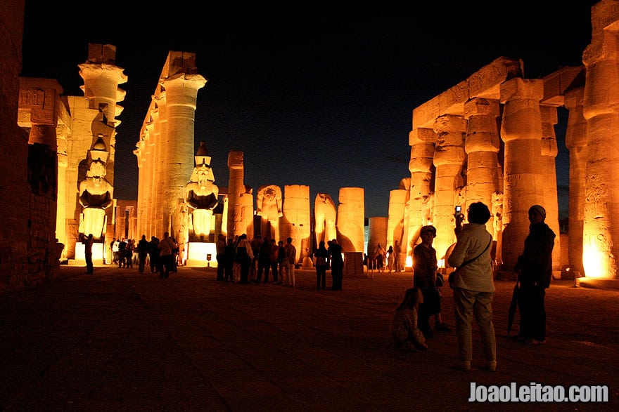 Tourists inside Luxor Temple by night