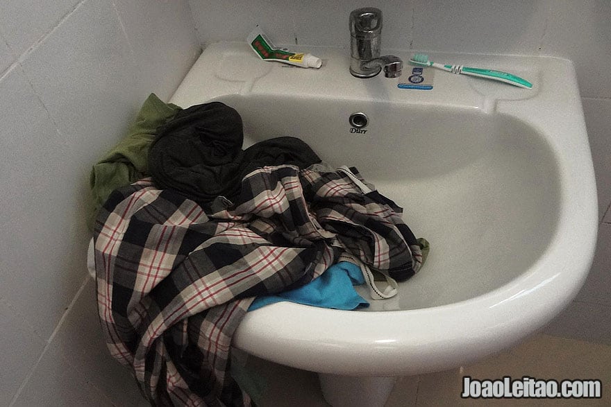 How to Do Laundry While Traveling - Washing clothes in the hotel bathroom sink