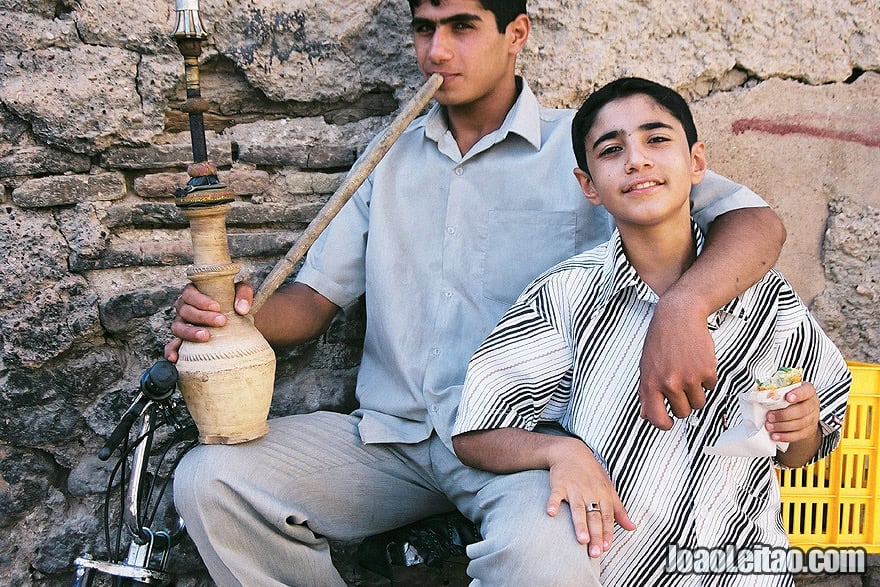 Boys smoking water pipe in Shiraz