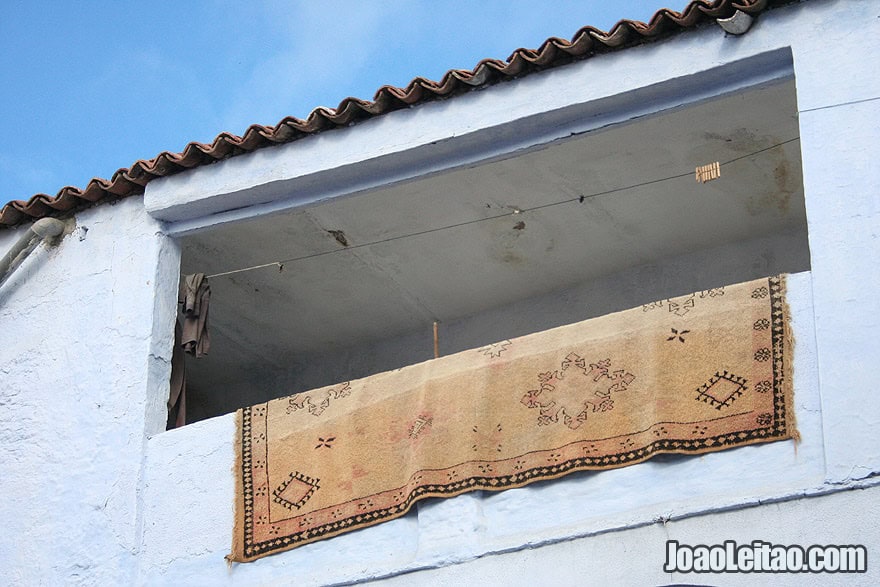 Chefchaouen carpet hanging in house patio 