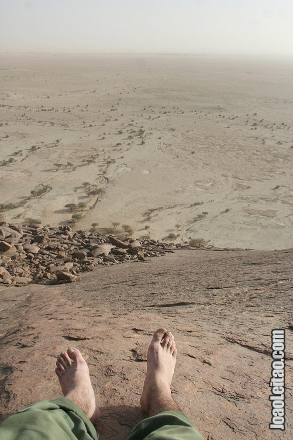 Climbing Ben Amera monolith in Sahara Desert