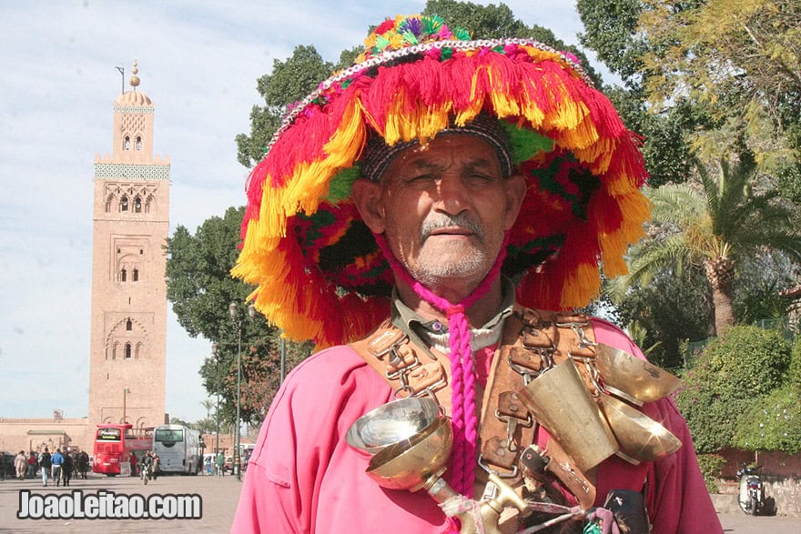 Water seller posing for picture